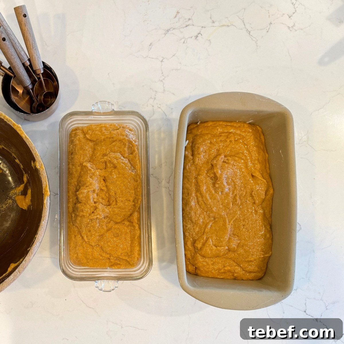 Moist Sourdough Pumpkin Bread Recipe for Fall Baking 5 sourdough pumpkin bread dough in buttered loaf pans