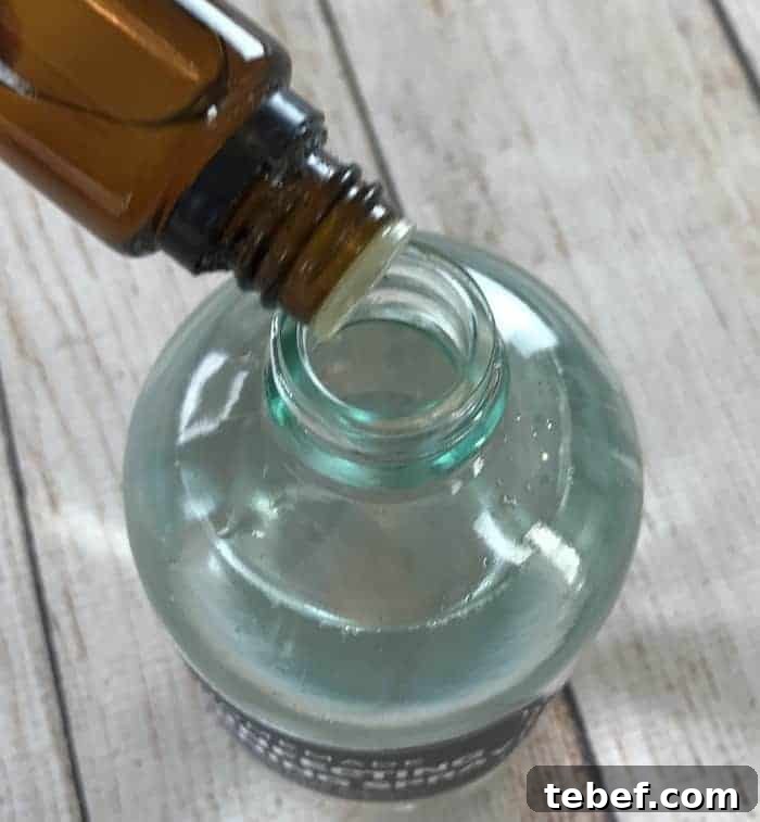 DIY Disinfecting Cleaning Spray Recipe That Kills Germs 7 add essential oils to spray bottle