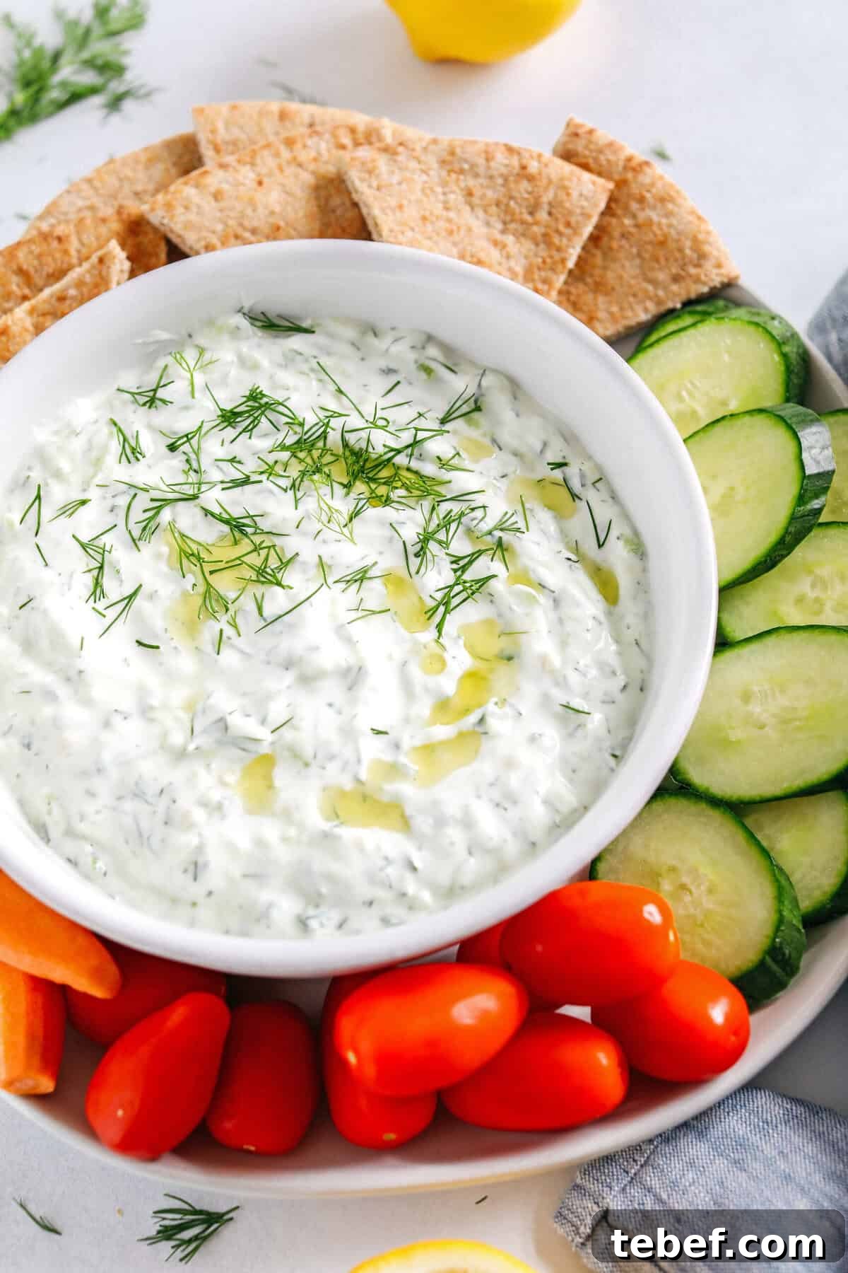 Authentic Homemade Tzatziki Recipe — Creamy Greek Sauce Guide 4 Tzatziki served in a bowl with fresh herbs