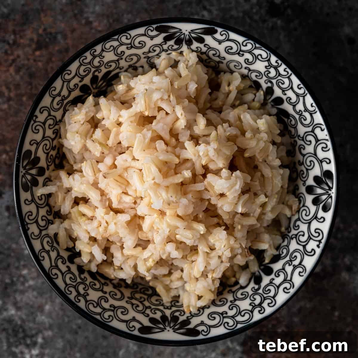 Perfectly Fluffy Brown Rice: Simple Step-by-Step Cooking Guide 2 brown rice in a black and white bowl