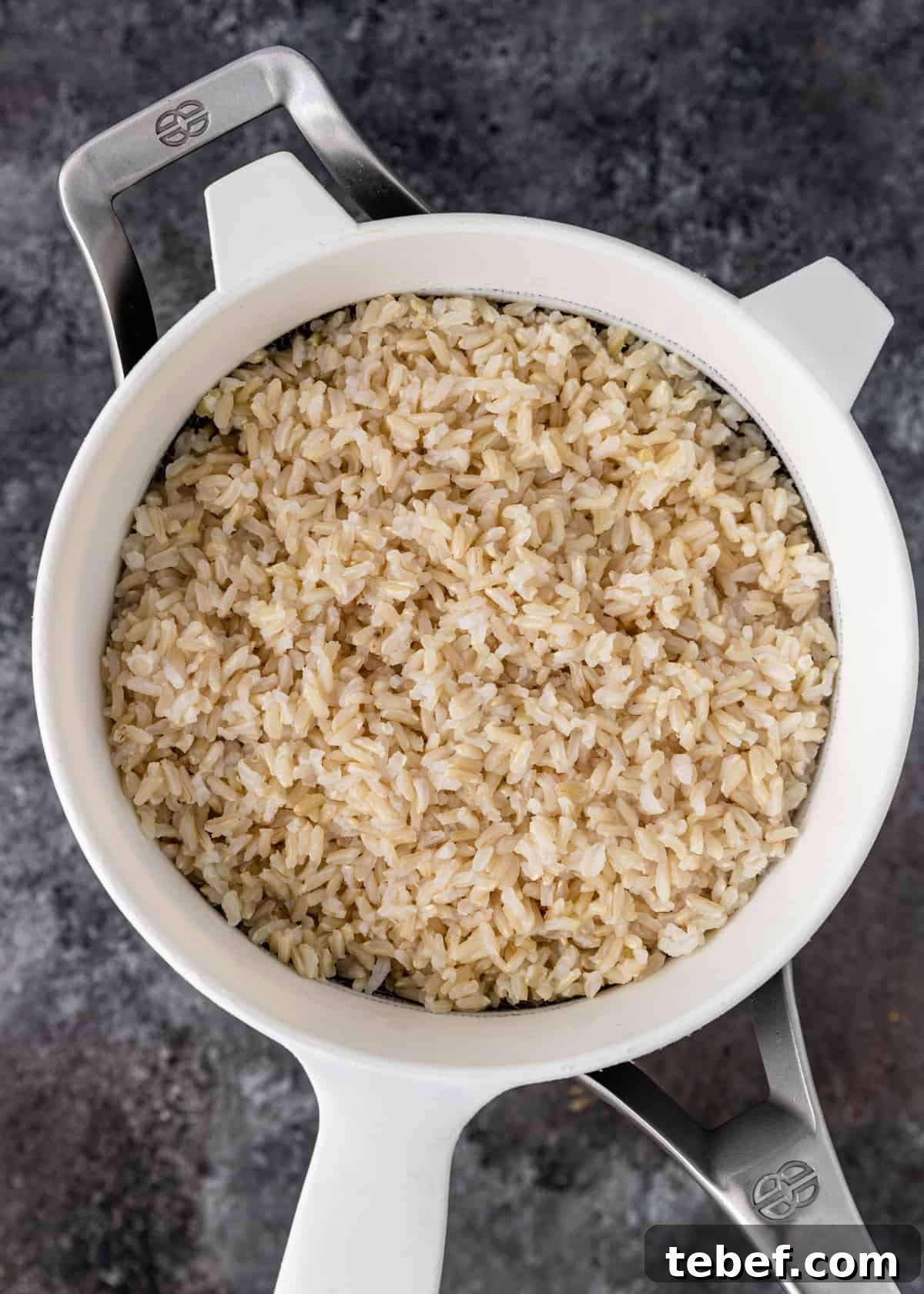 Perfectly Fluffy Brown Rice: Simple Step-by-Step Cooking Guide 5 overhead shot of cooked rice in sieve