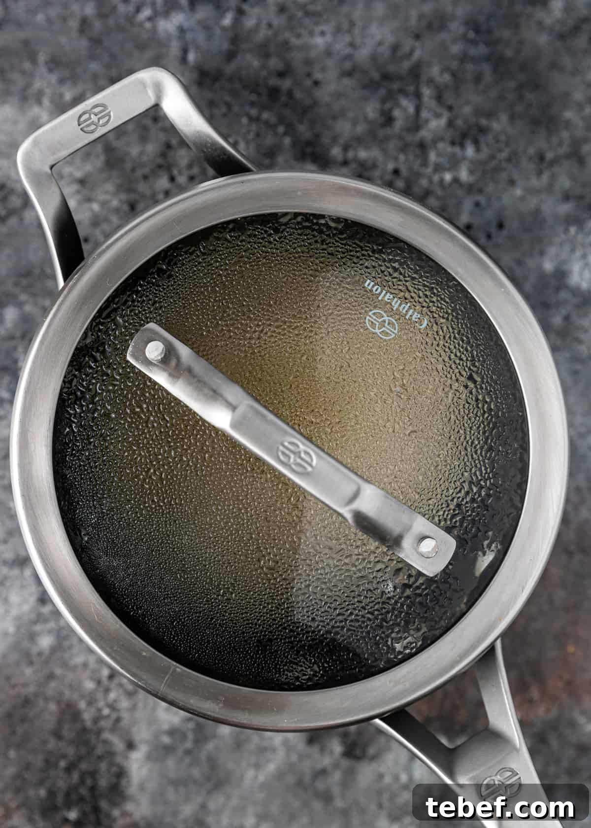 Perfectly Fluffy Brown Rice: Simple Step-by-Step Cooking Guide 6 pan of steaming rice with a lid