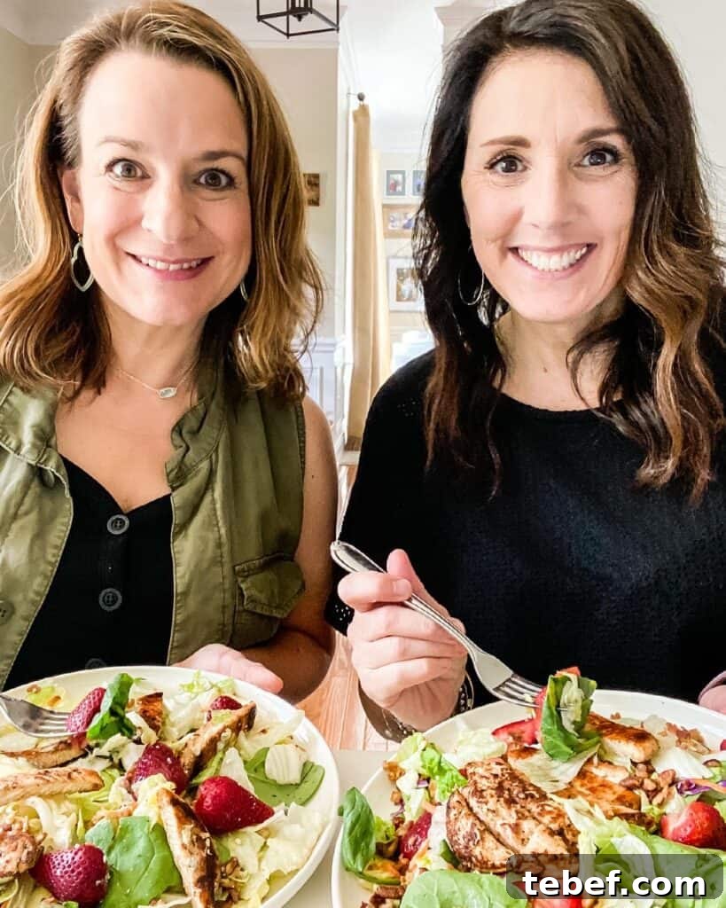 Chic Summer Dinner Party Ideas to Impress Your Guests 2 two women eating salads at table in dining room smiling