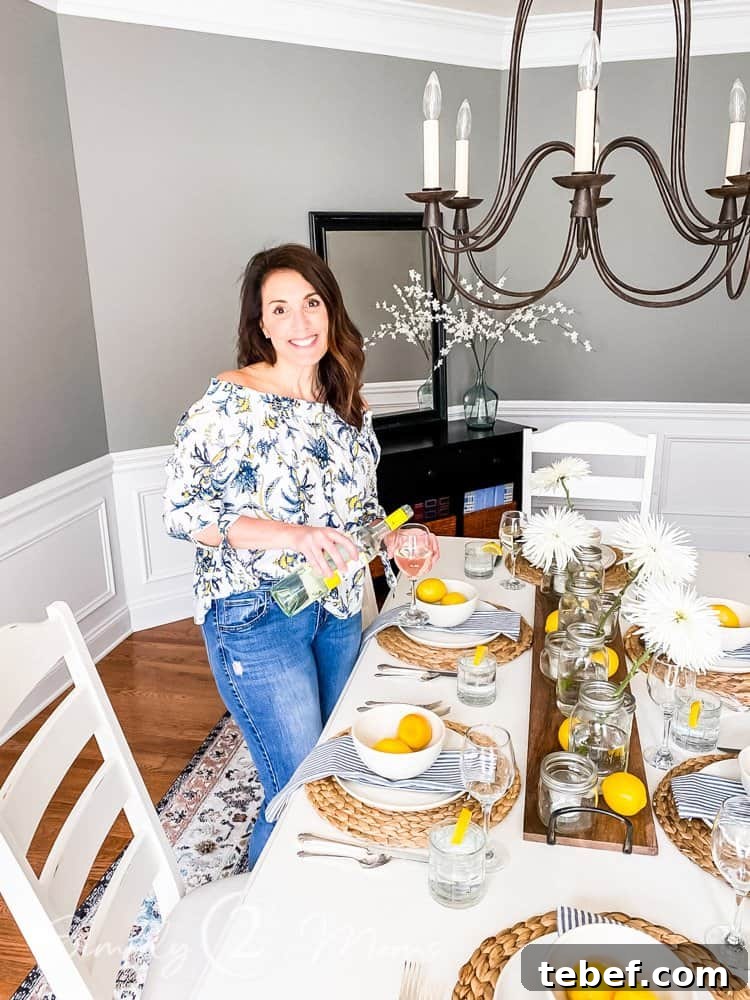 Chic Summer Dinner Party Ideas to Impress Your Guests 12 woman pouring glass of wine in dining room set for summer