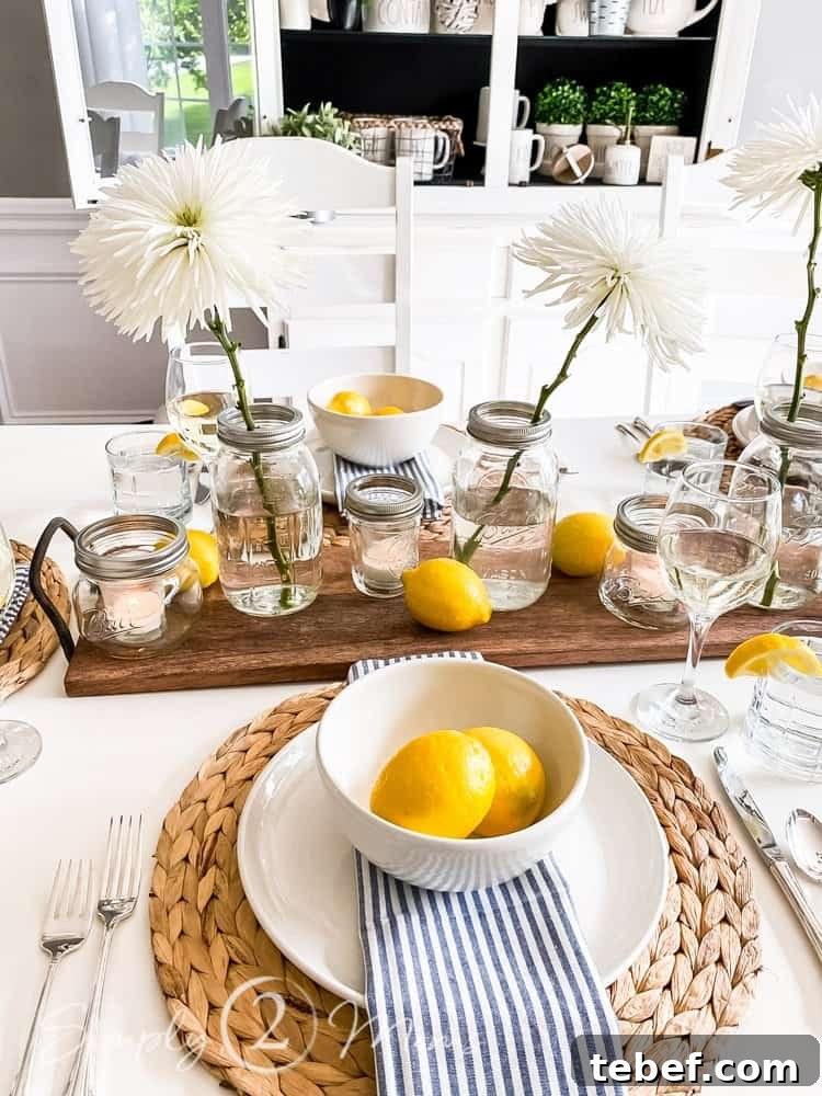 Chic Summer Dinner Party Ideas to Impress Your Guests 10 lemons in bowls on top of placesetting with striped napkin, white plate and seagrass charger