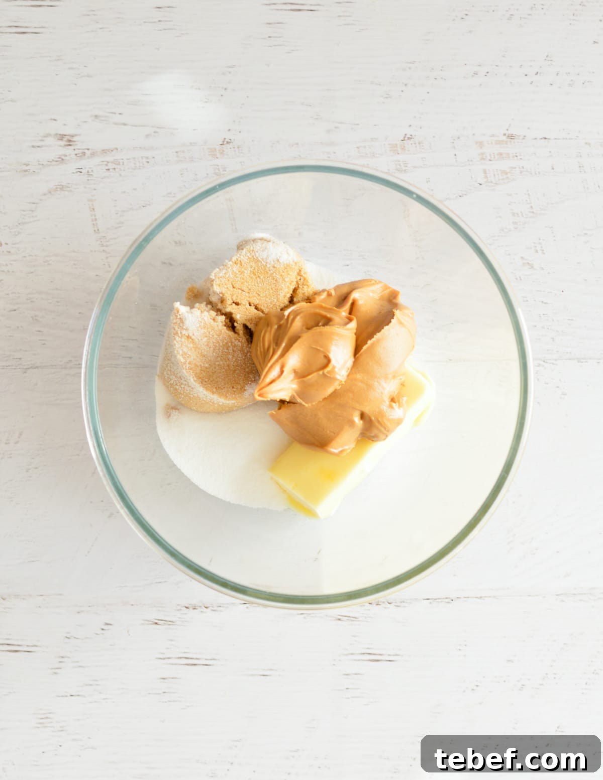 Irresistibly Chewy Peanut Butter Cookie Recipe 4 peanut butter, butter, and sugar in a bowl.