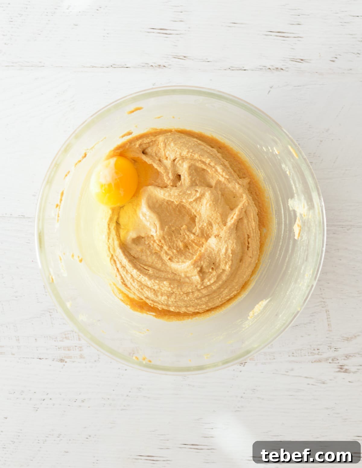 Irresistibly Chewy Peanut Butter Cookie Recipe 5 creamed butter and peanut butter with an egg on top.