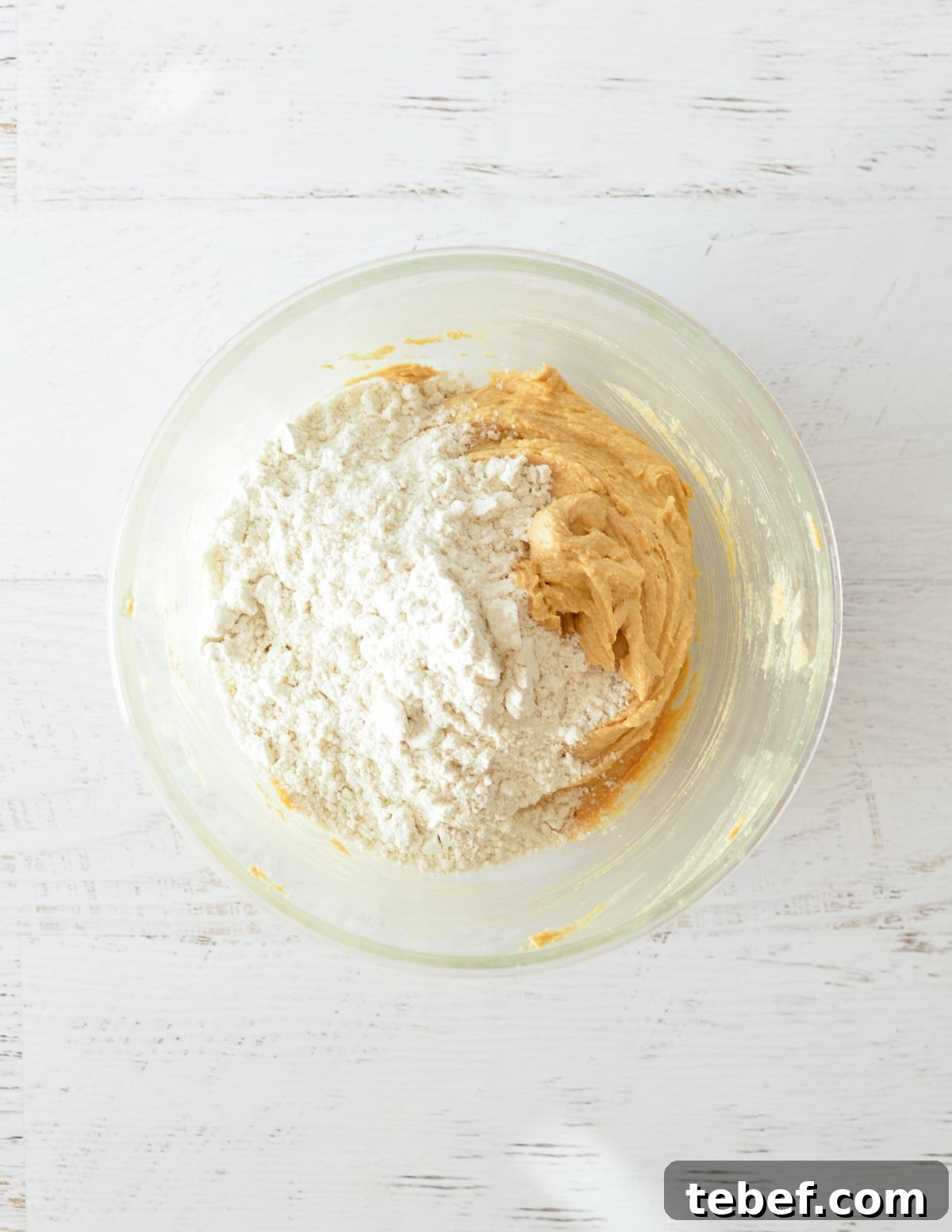 Irresistibly Chewy Peanut Butter Cookie Recipe 7 flour on peanut butter mixture.