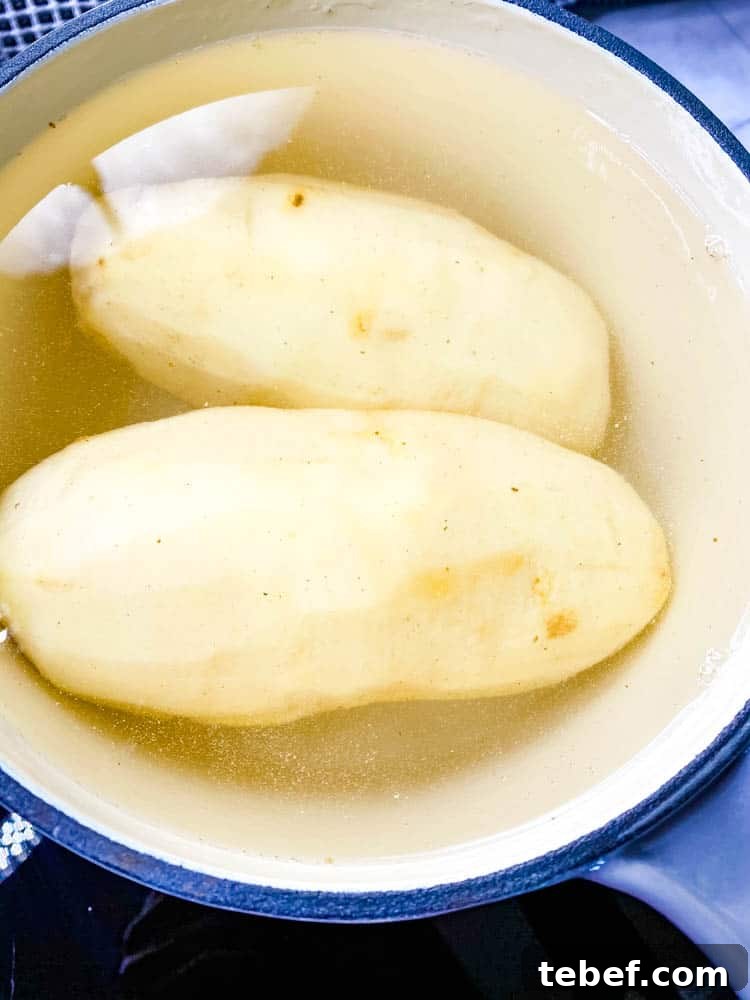 Crispy Air Fryer Tater Tots: Perfectly Golden Every Time 5 potatoes boiling in a saucepan