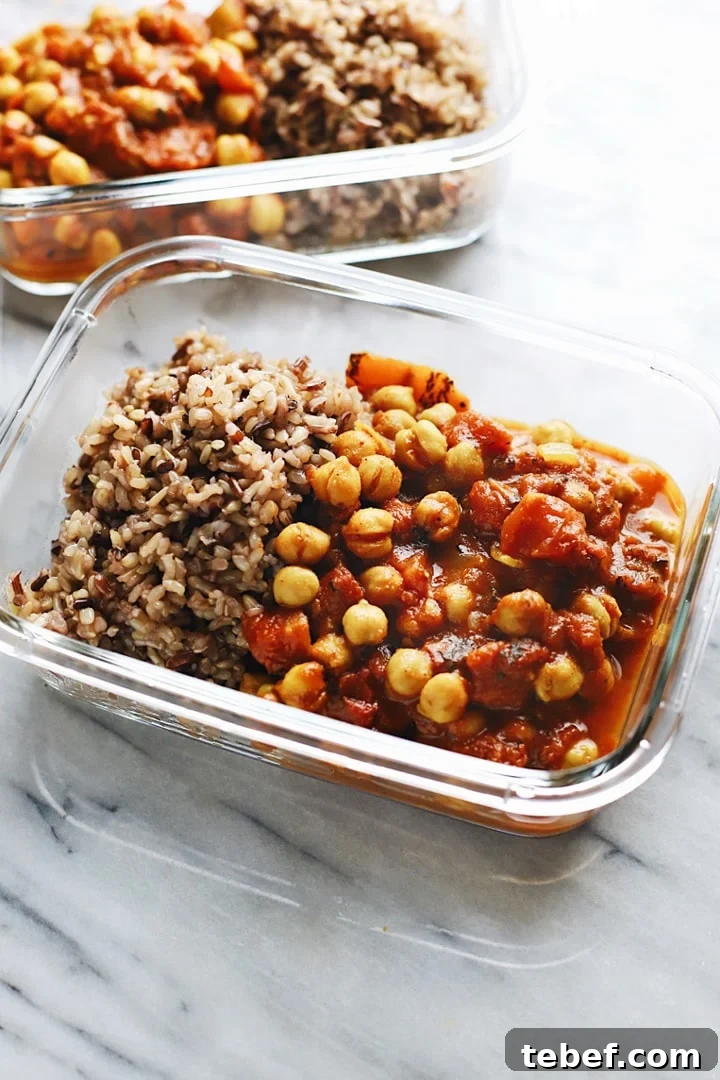 Moroccan chickpea stew in a glass storage bowl with rice.