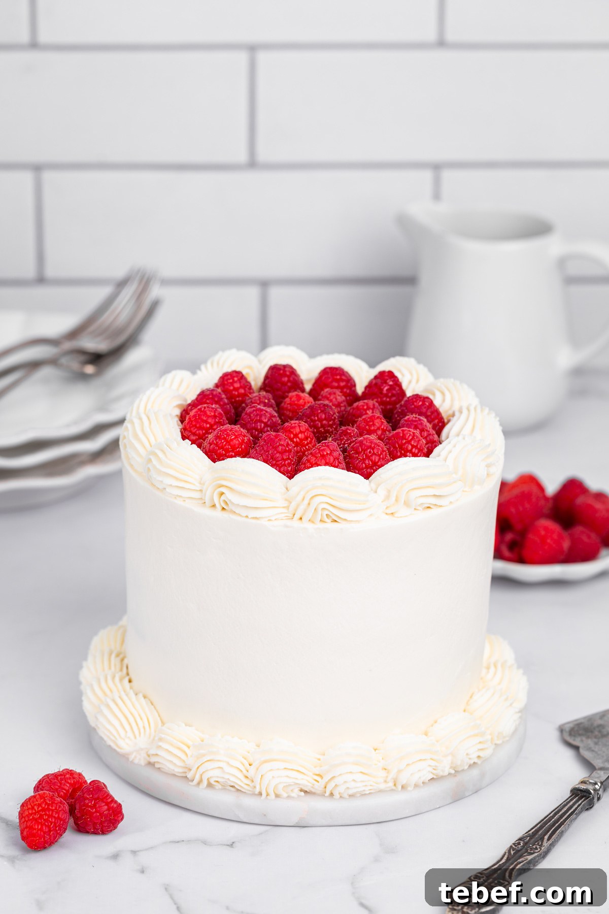 Raspberry Mascarpone Layer Cake with Fresh Cream Filling 2 Raspberry mascarpone cake decorated with fresh raspberries on top