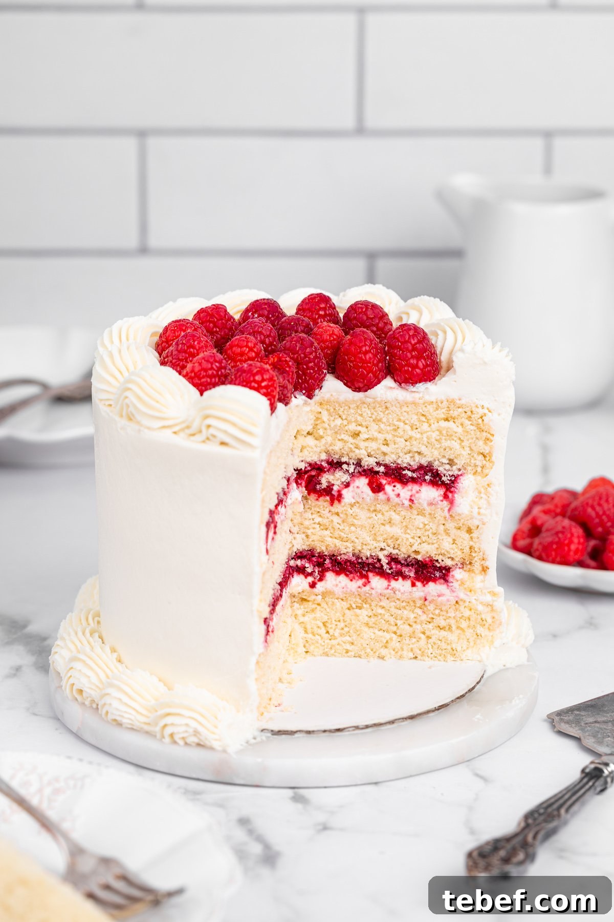 Raspberry Mascarpone Layer Cake with Fresh Cream Filling 11 Slice of raspberry mascarpone cake on a table