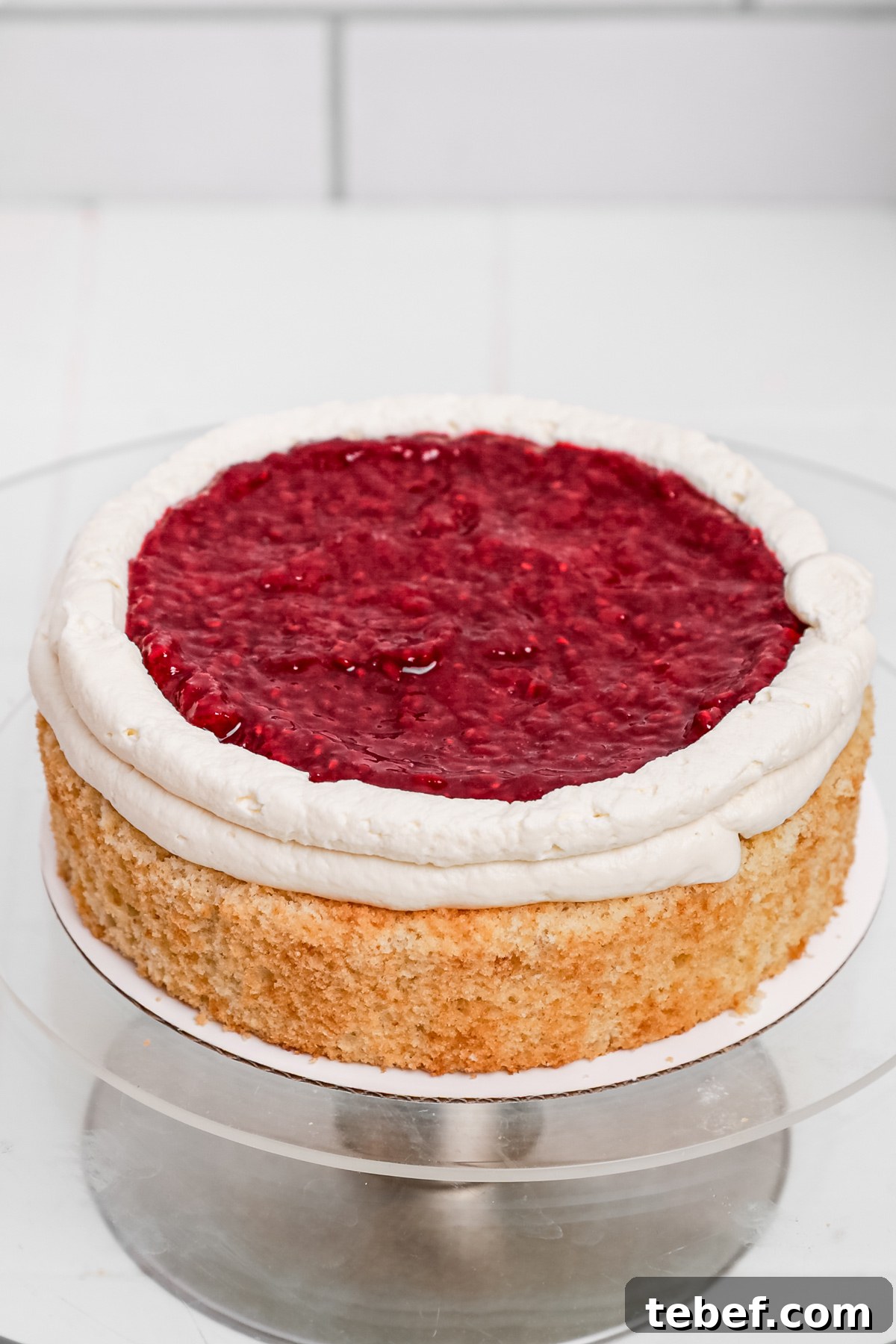 Raspberry Mascarpone Layer Cake with Fresh Cream Filling 9 Vanilla cake layer filled with mascarpone frosting and raspberry compote