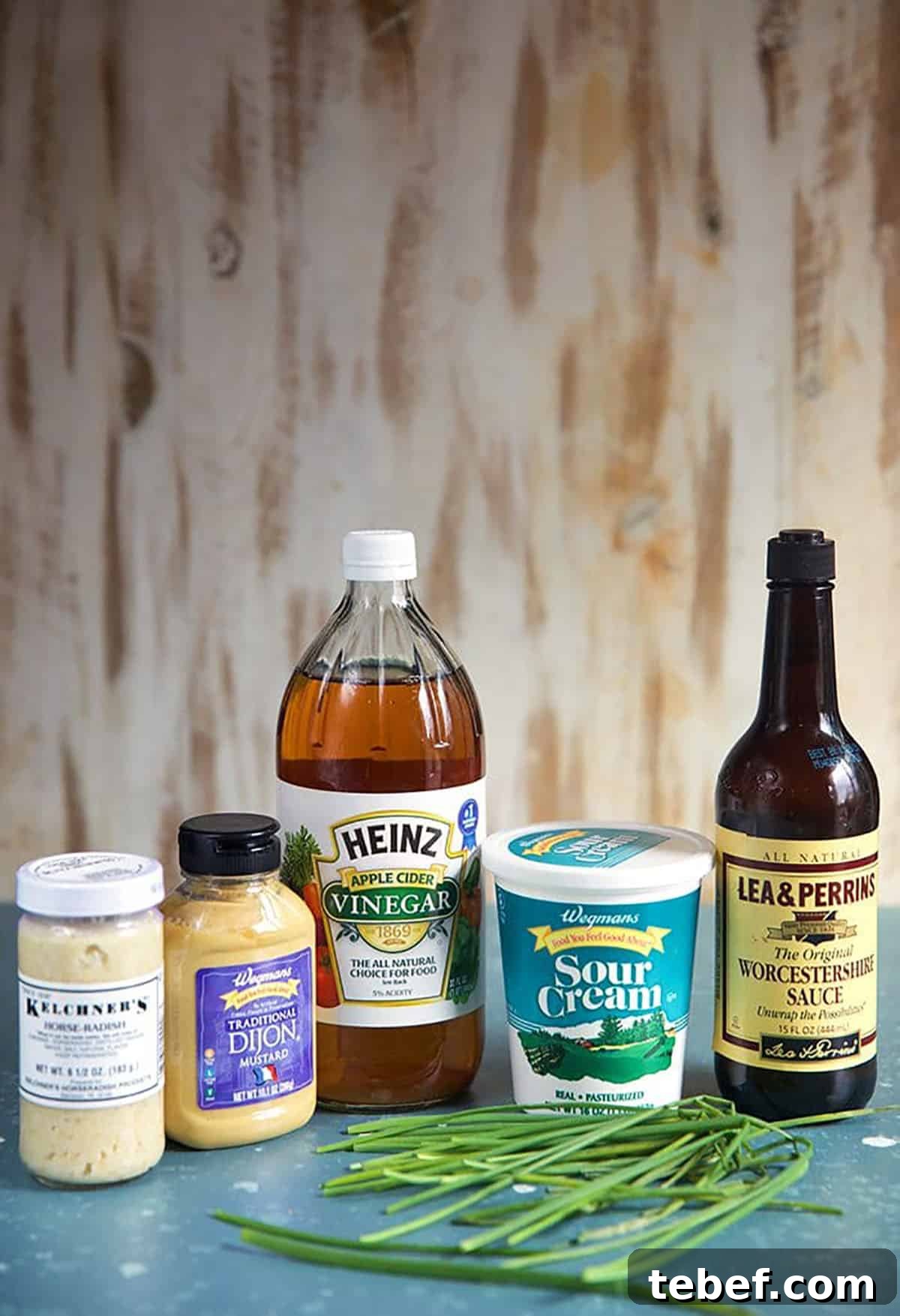 Creamy Horseradish Sauce Recipe: Smooth, Tangy & Versatile 3 Ingredients for Creamy Horseradish Sauce, a bottle of horseradish, dijon mustard, apple cider vinegar, sour cream Worcestershire sauce and chives.