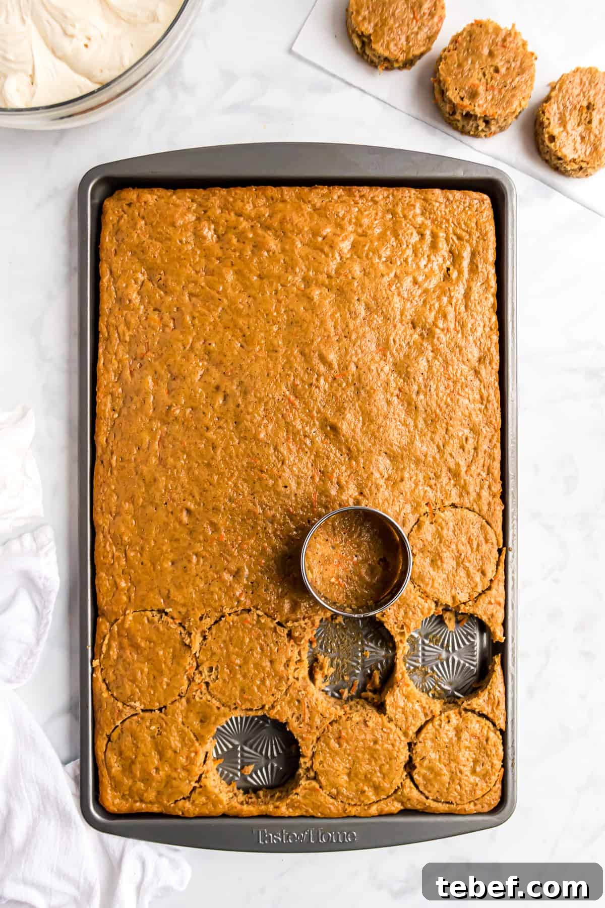 Carrot cake being cut into circles.