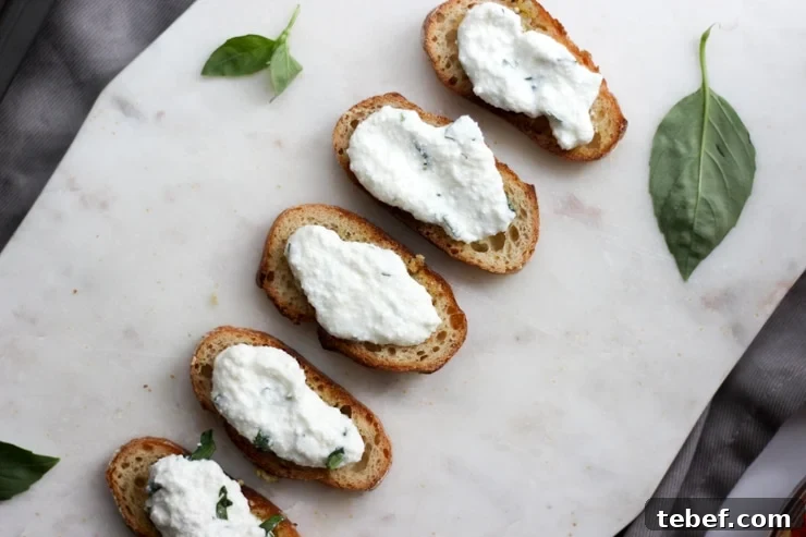 fresh whipped ricotta on top of garlic baguettes