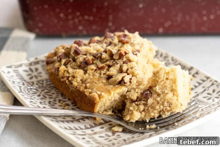 piece of cowboy coffee cake on plate with bite on fork