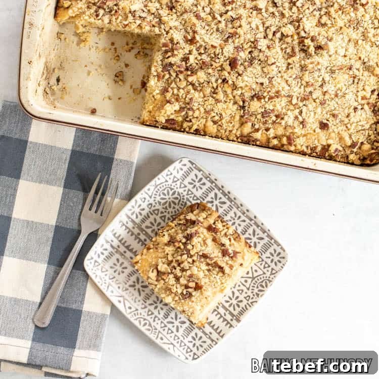 piece of cowboy coffee cake on plate with pan behind