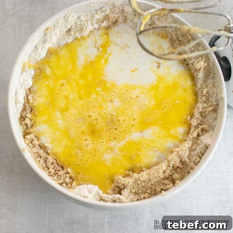 wet ingredients on top of dry ingredients in bowl