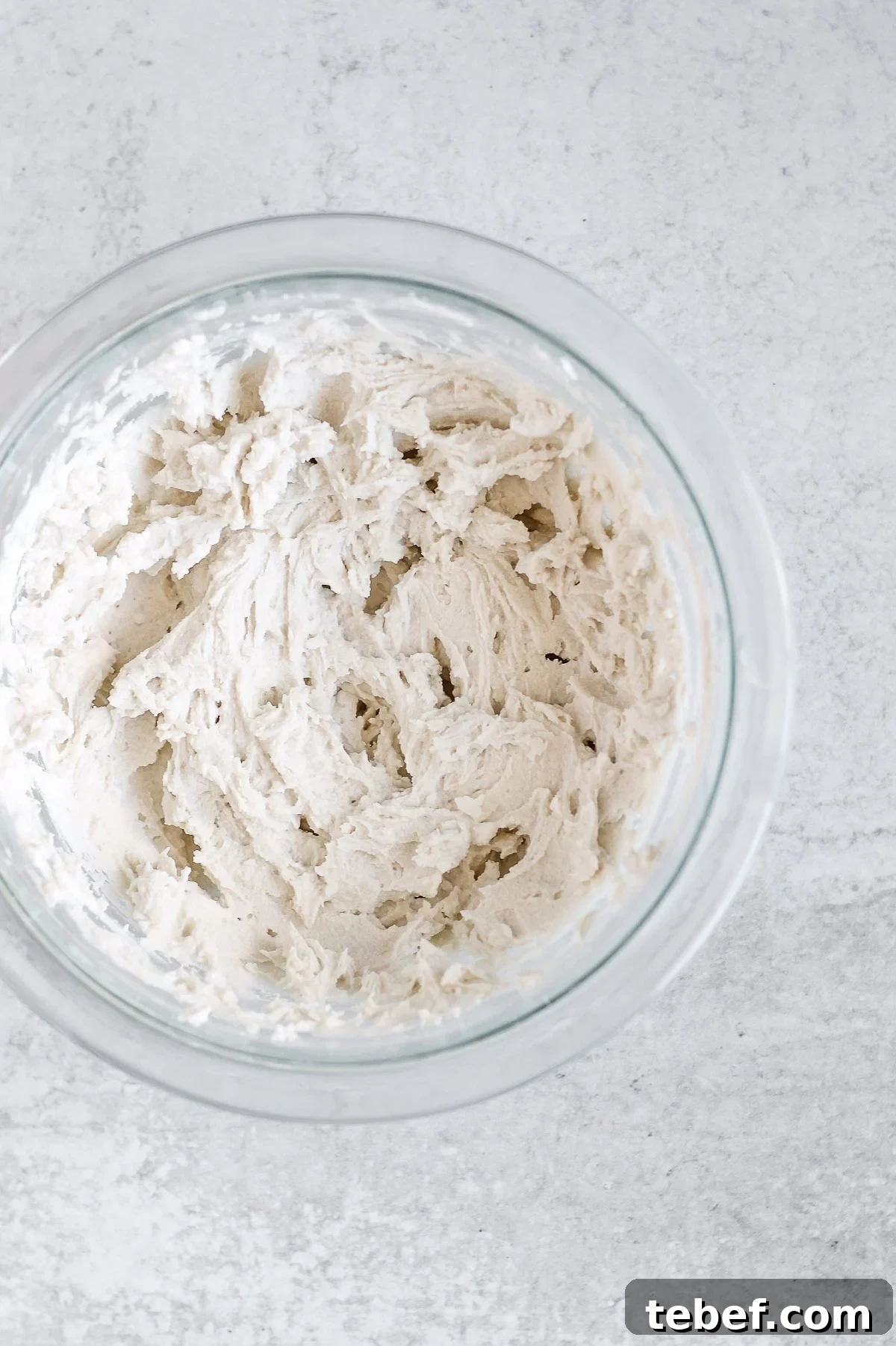 Coconut Whipped Cream Recipe: Light, Dairy-Free Topping in Minutes 6 coconut whipped cream in glass mixing bowl