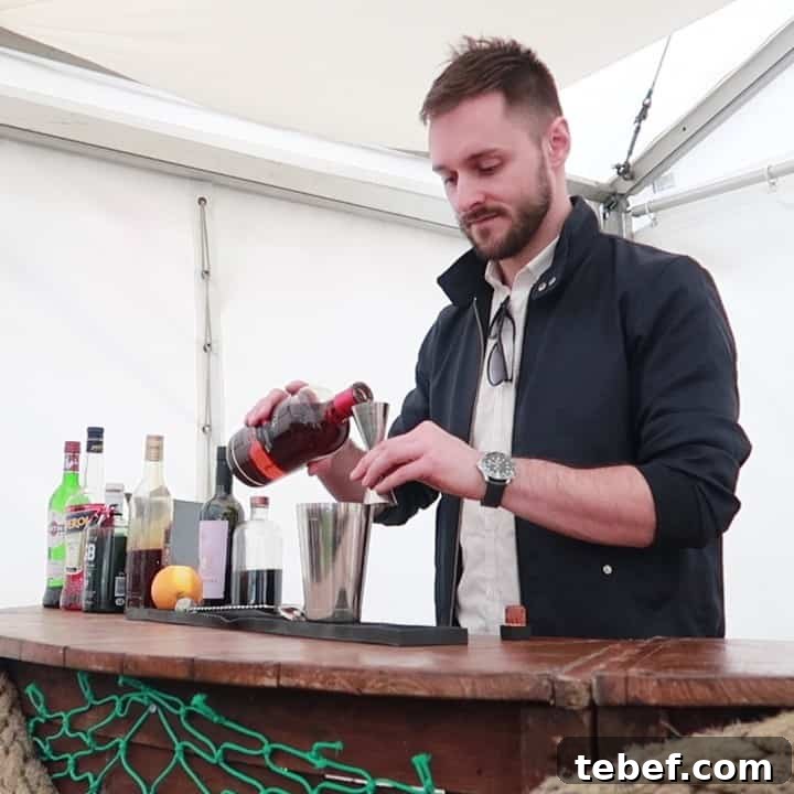 Porthleven Food Festival — Cornwall’s 2019 Seafood & Street Food Guide 3 Bar tender pouring spirits into a cocktail shaker at the Porthleven Food Festival 2019