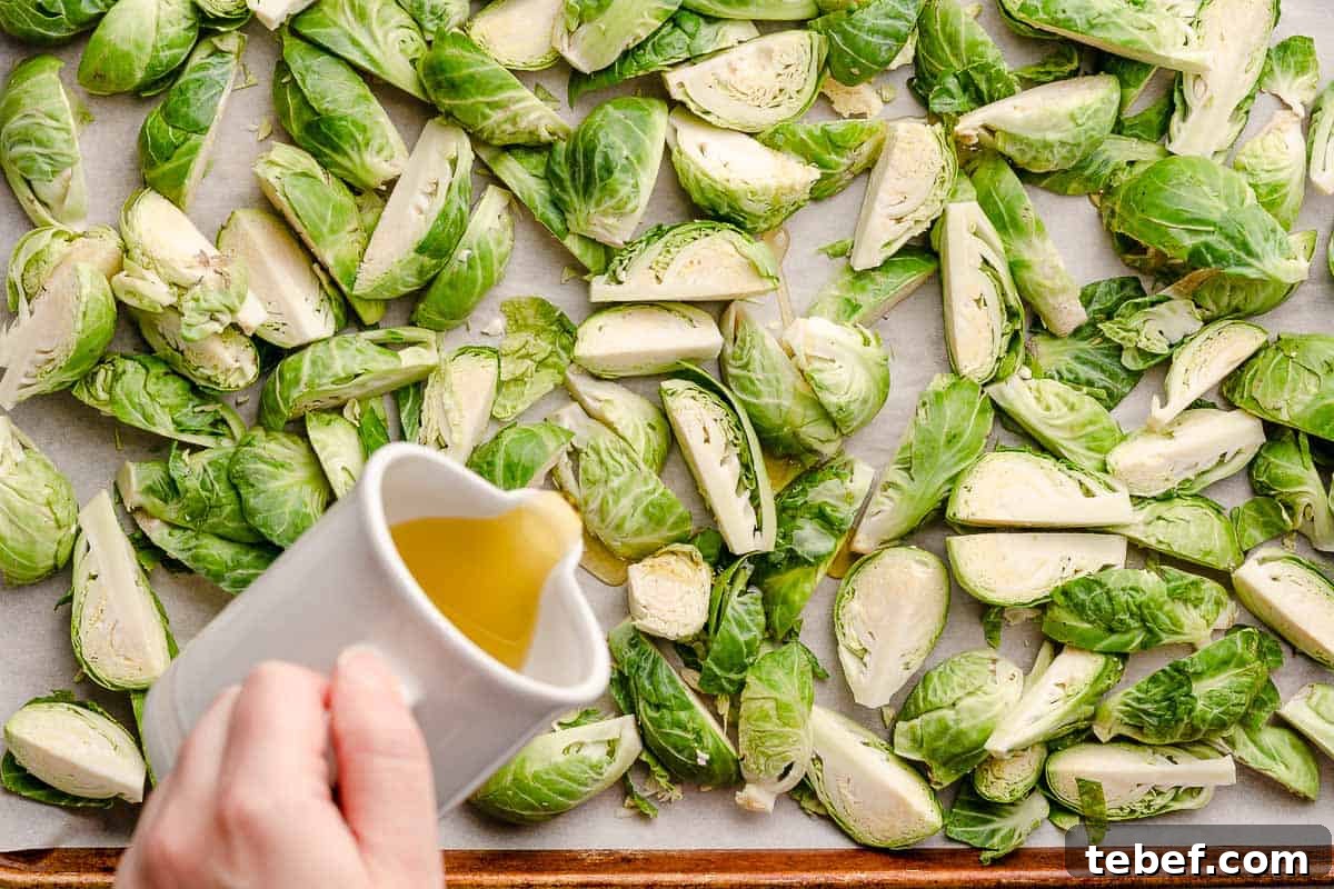 drizzling oil over brussels sprouts