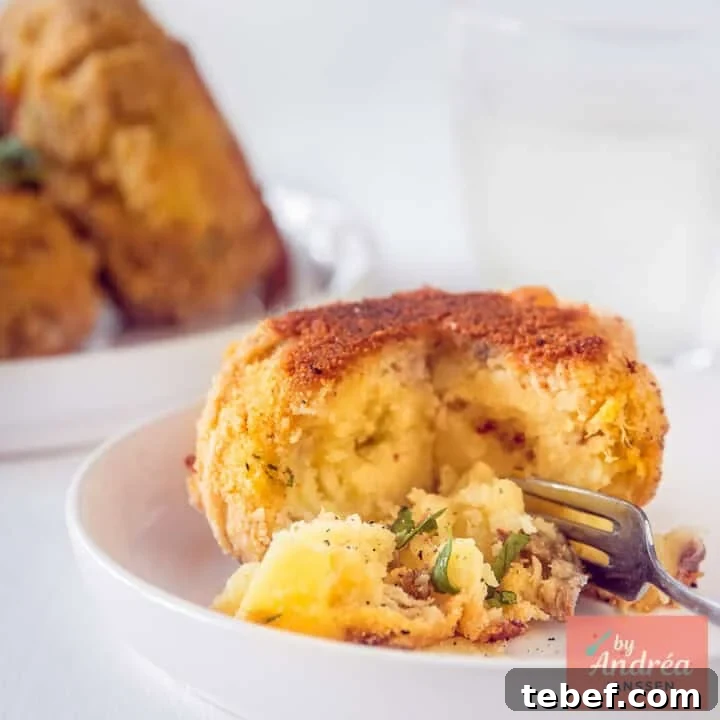 A square picture with a smoked mackerel fish cake. A bite taken off.