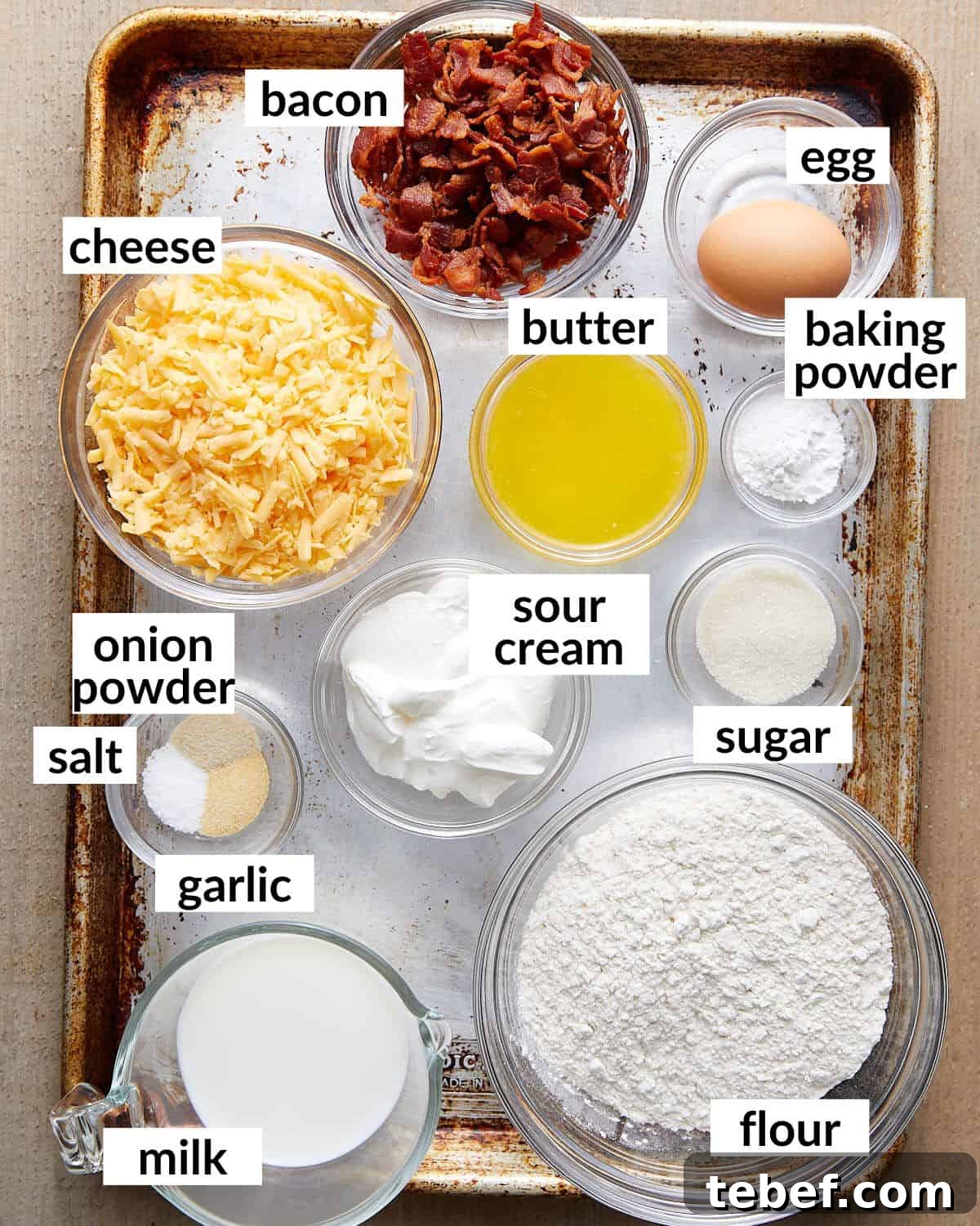 Savory Bacon and Cheddar Muffins for Breakfast or Brunch 3 Overhead image of ingredients needed for bacon and cheddar cheese muffins.