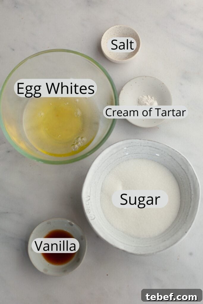 All the ingredients needed to make marshmallow meringue frosting, weighed out into small bowls.
