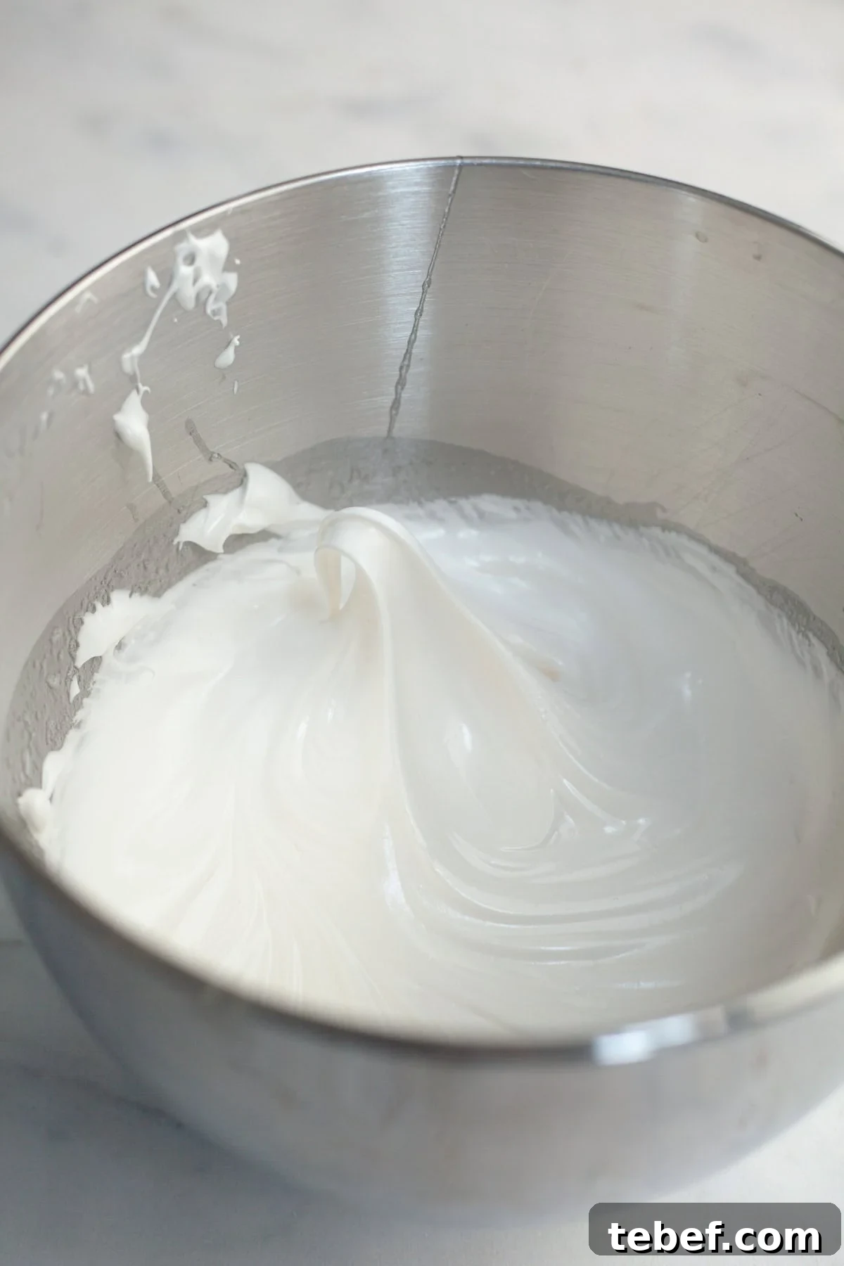 White meringue in a mixing bowl.