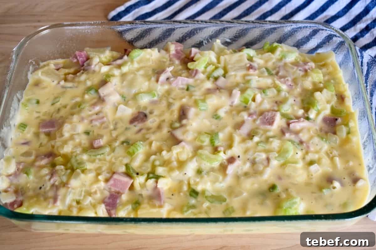 Cheesy Ham and Potato Casserole Recipe for Leftover Ham 8 Creamy sauce poured over the potatoes and ham in a greased baking dish.
