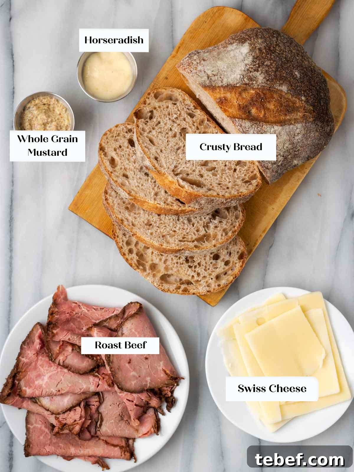 beef sandwich ingredients on marble.