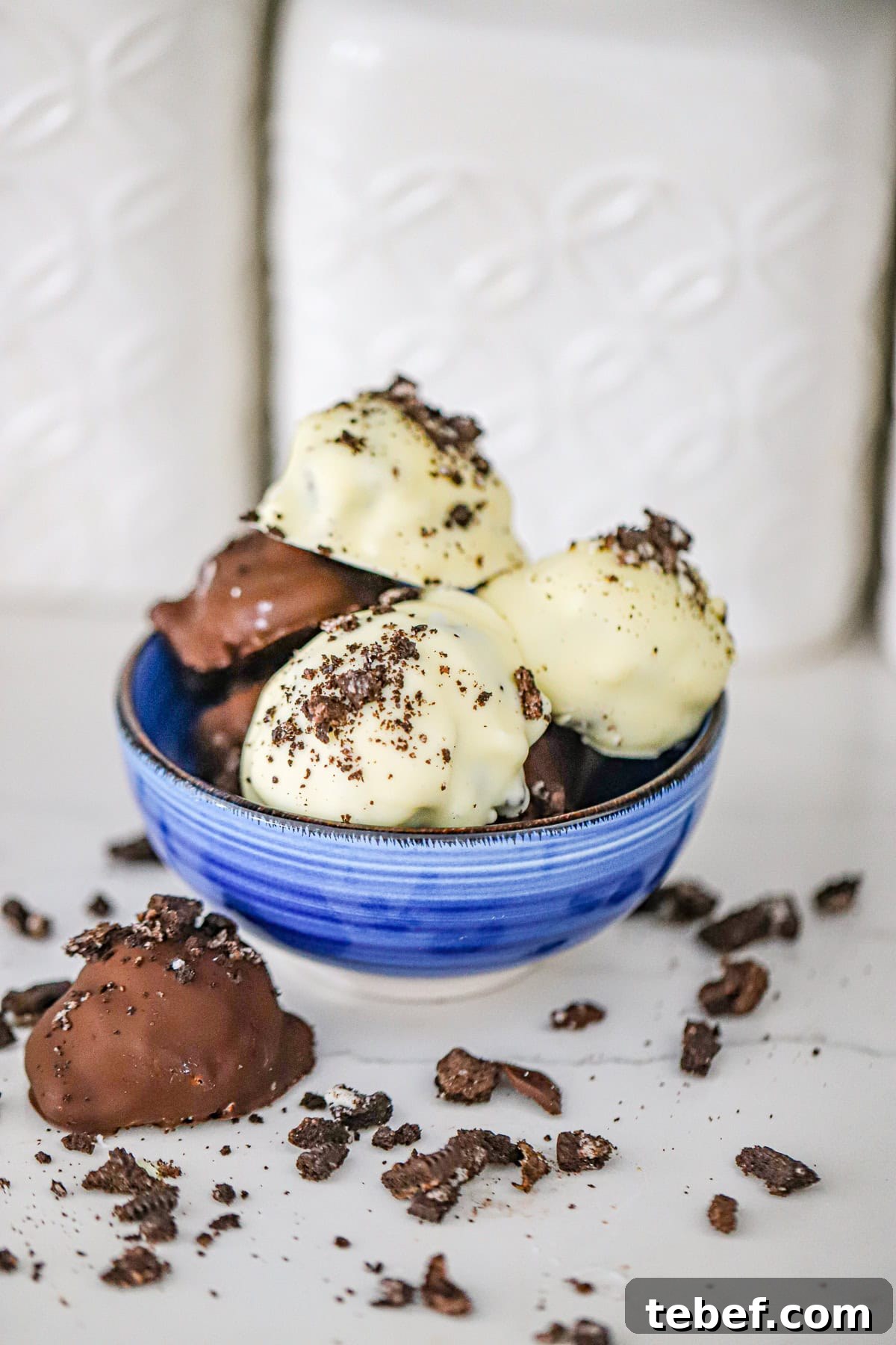 White chocolate coated dessert bites with crushed Oreo cookie crumbs frozen oreo clusters