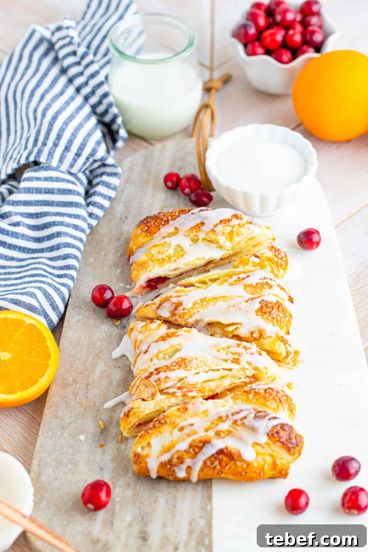 Cranberry Orange Sweet Braid Recipe — Flaky Holiday Pastry 3 Cranberry Orange Braid on cutting board