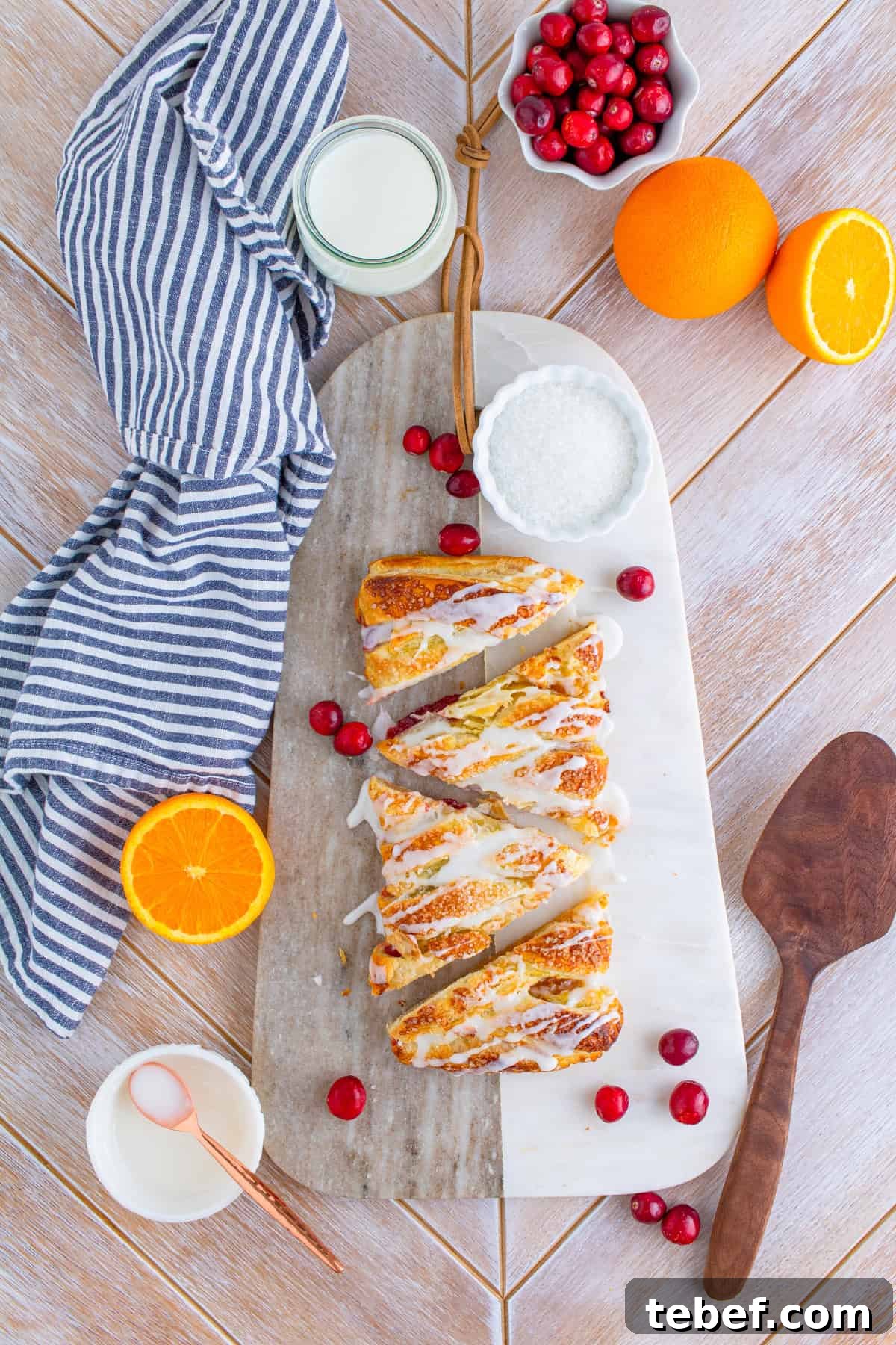 Cranberry Orange Sweet Braid Recipe — Flaky Holiday Pastry 5 Overhead of Cranberry Orange Braid cut into slices