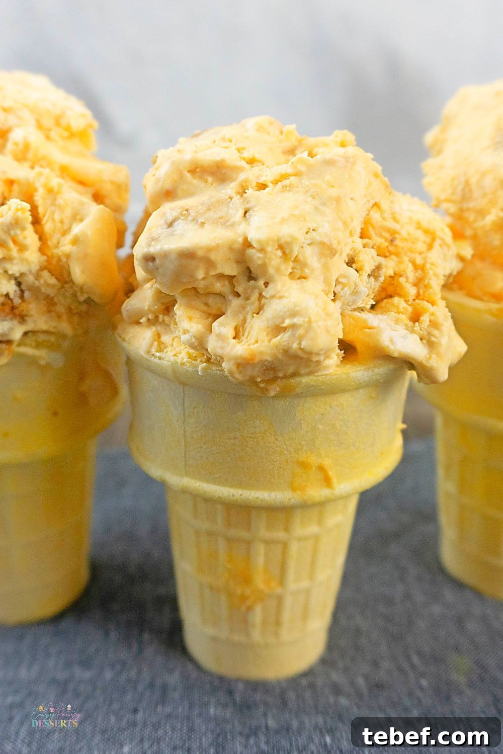 Close up image of homemade pumpkin ice cream in ice cream cones