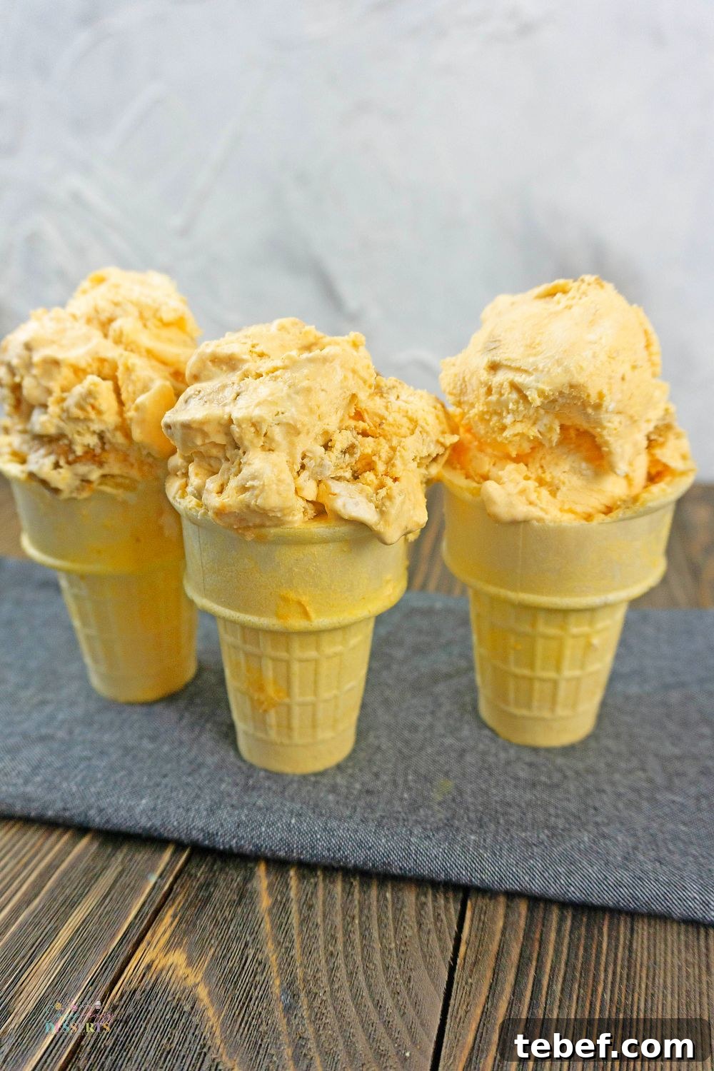 Close up image of pumpkin gingersnap ice cream in ice cream cones