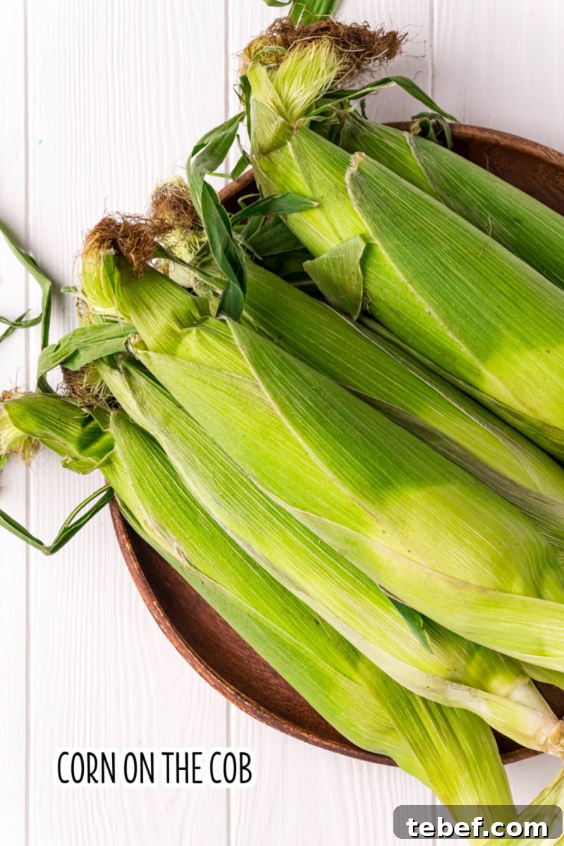 Perfect Grilled Corn on the Cob: Simple Charred Flavor Recipe 4 ears on cob with the husk on