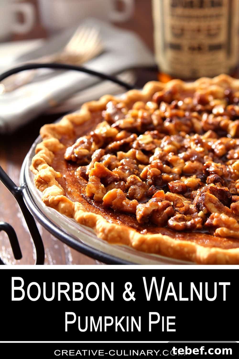 Bourbon Pumpkin Pie with Toasted Walnut Crumble 4 Boubon and Pumpkin Pie with Walnuts in a black metal pie server.v