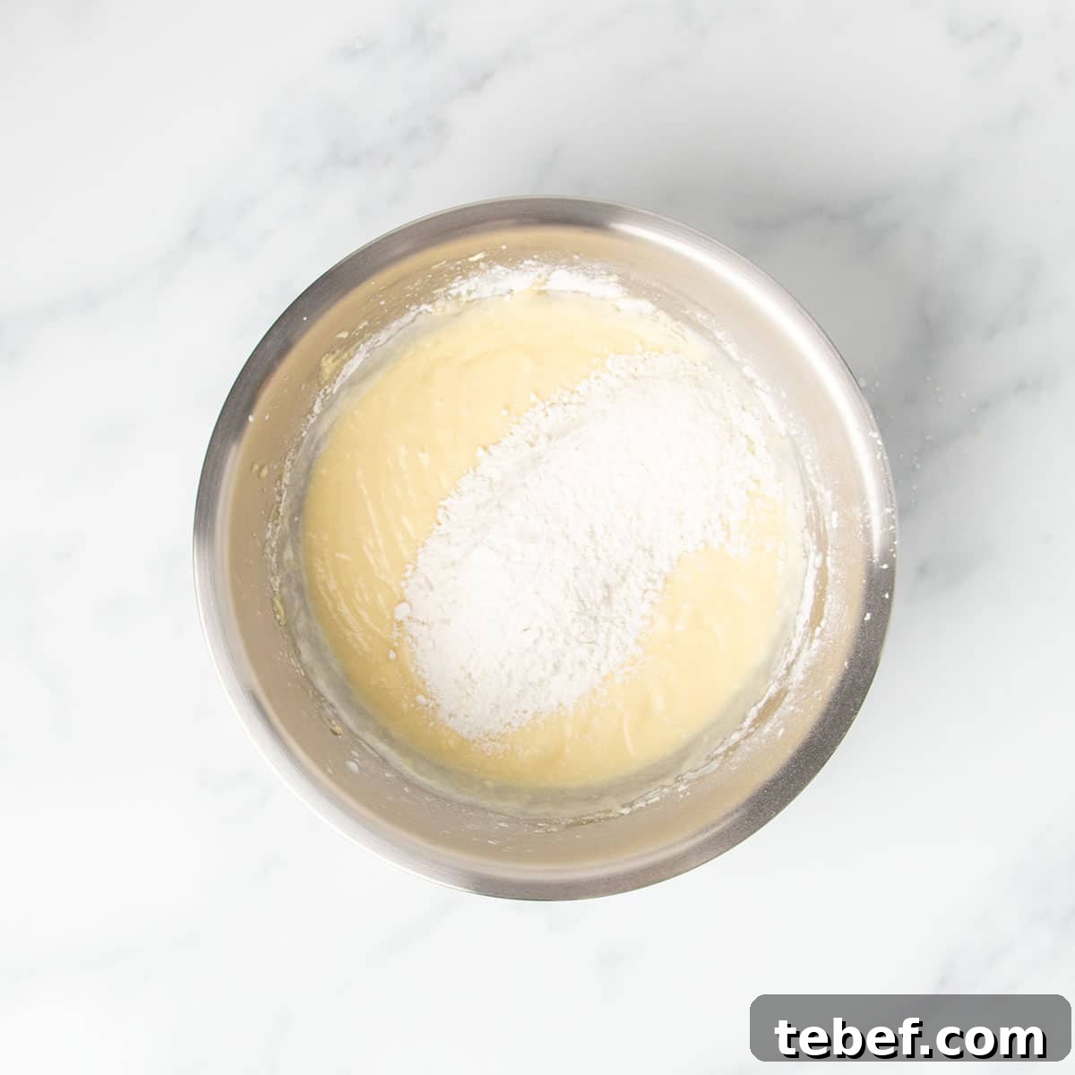 Gluten-Free Vanilla Cupcakes Recipe for Moist, Fluffy Results 11 rest of white powder dry ingredients on top of yellow cake batter
