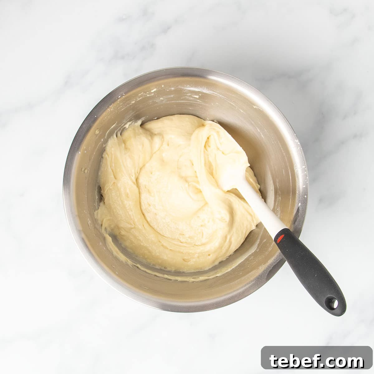 Gluten-Free Vanilla Cupcakes Recipe for Moist, Fluffy Results 12 soft, thick light yellow gluten free vanilla cupcake batter with swirl from being mixed with white spatula with black handle