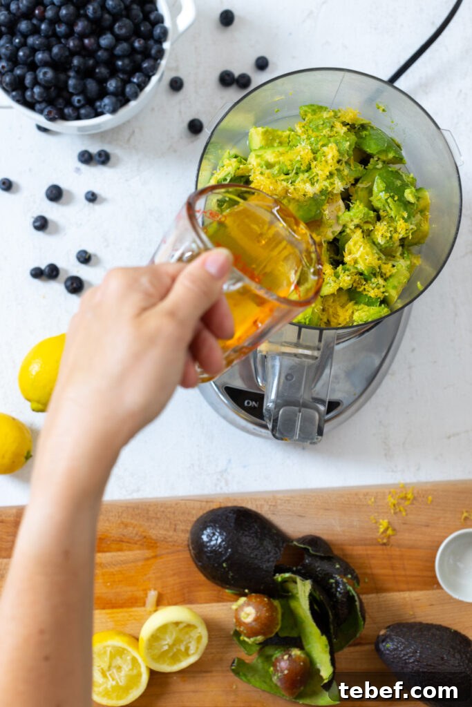Combining avocado tart filling ingredients