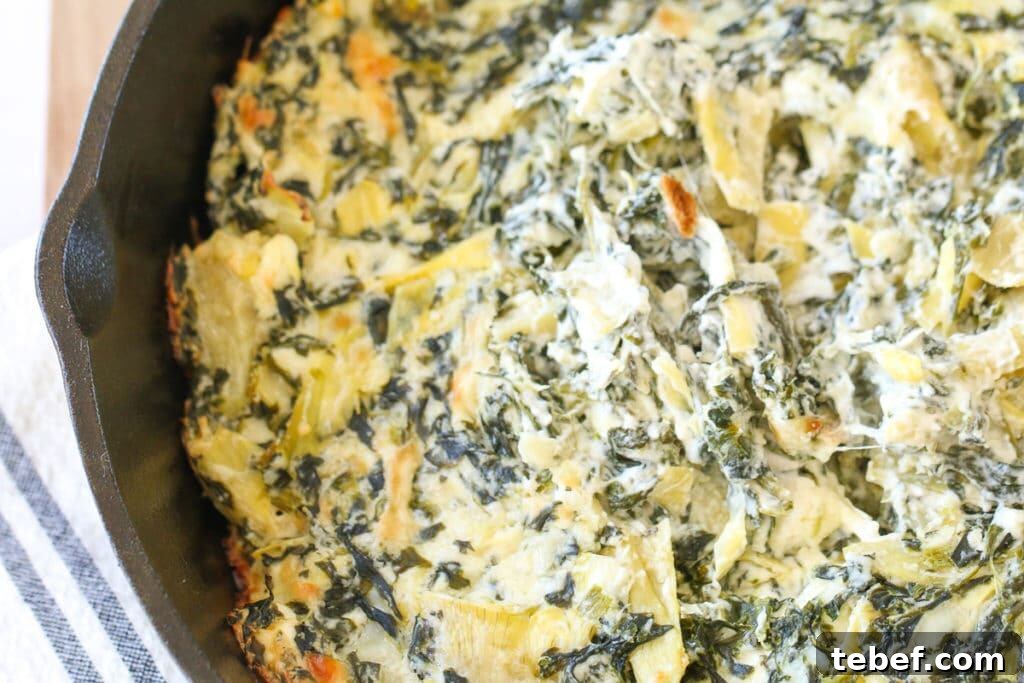 Ever wonder how to make spinach artichoke dip perfectly creamy? I'll share my secrets to flavorful and perfect baked spinach artichoke dip. spinach artichoke dip in a skillet