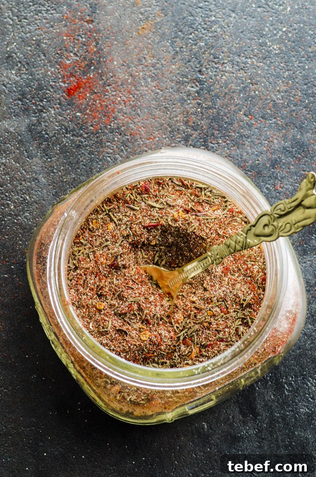 Authentic Jamaican Jerk Seasoning Recipe & Homemade Spice Blend 4 A clear bowl with Jamaican Jerk seasoning