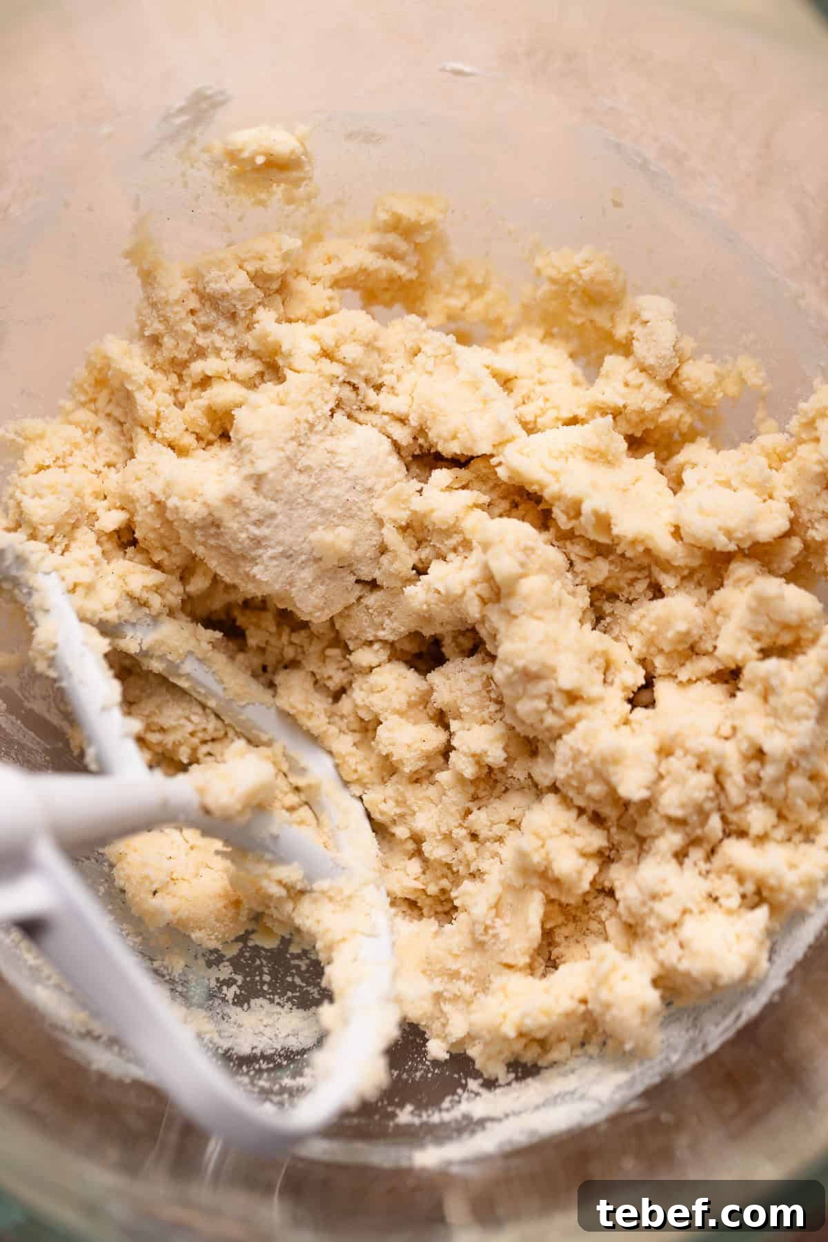 Zesty Lemon Bars with Buttery Shortbread Crust 3 Shortbread dough in a glass mixer bowl.