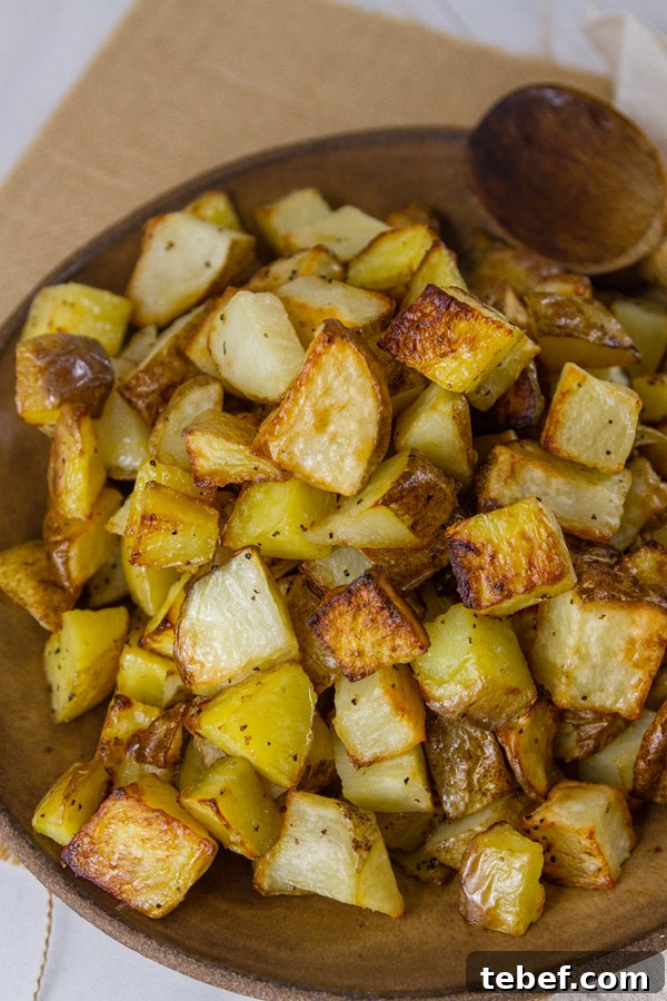 Sheet Pan Roasted Potatoes are an easy, delicious side dish for any meal. This super easy method produces perfectly cooked potatoes that are crispy outside and tender and creamy inside. Potatoes in a bowl