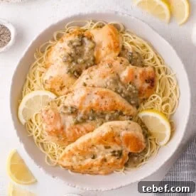 A bowl of chicken piccata with lemon-caper sauce.