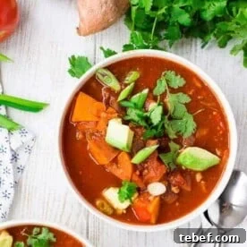 Bowl of chili with toppings.