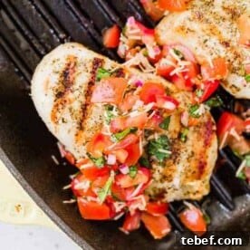 Grilled bruschetta chicken with tomato topping.