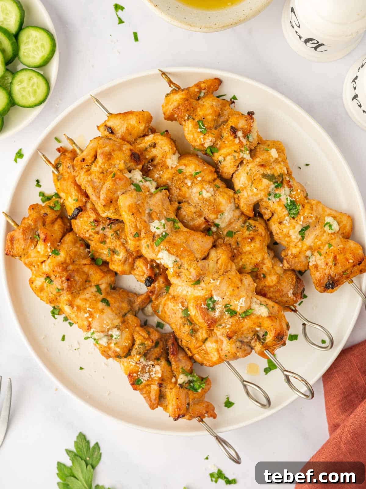 Juicy Oven-Baked Chicken Skewers: Simple Weeknight Recipe 2 Baked chicken skewers on a platter.